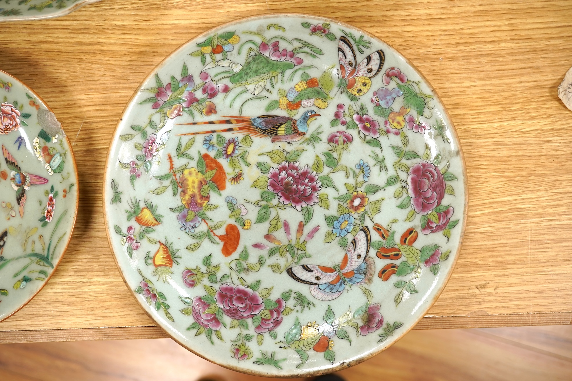 Four 19th century Chinese famille rose celadon ground dishes, largest 25cm